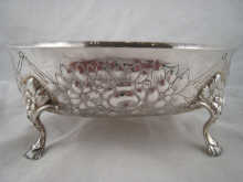 An embossed silver oval bowl on