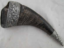 A buffalo horn with heavily embossed 14a637