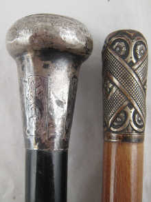 A silver topped ebony walking cane