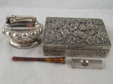 A silver cigar cutter a silver plated