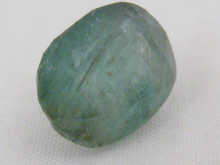 A loose polished emerald approx.