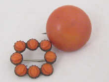 Two brooches including a carved coral