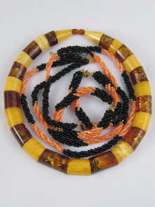 A two colour amber necklace of