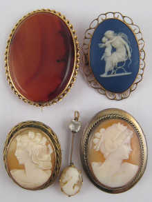 Four cameo brooches and an agate