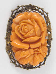 A carved coral brooch designed 14a6a2