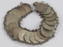 A white metal (tests silver) coin bracelet