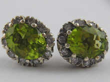 A pair of peridot and diamond earrings