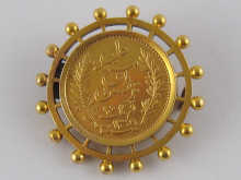A Tunisian 20 Franc gold coin in