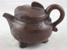 A Chinese Yixing teapot with impressed