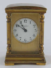 A domed type miniature carriage clock