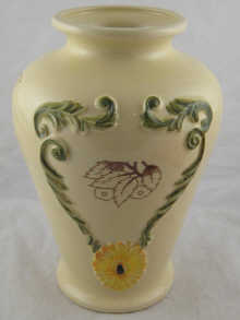 A ceramic vase with raised decoration
