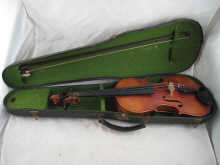 A violin and bow in hard case.