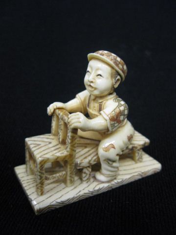 Carved Ivory Netsuke of a Seated