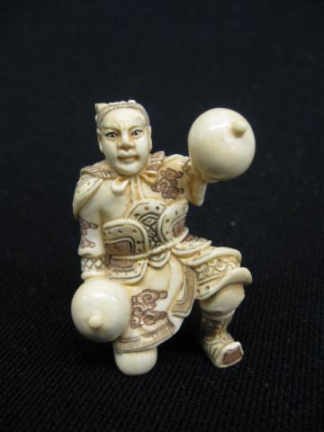 Carved Ivory Netsuke of Man Playing 14d35b