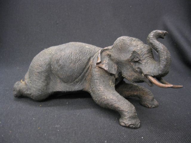 Carved Wooden Elephant Figurine at rest