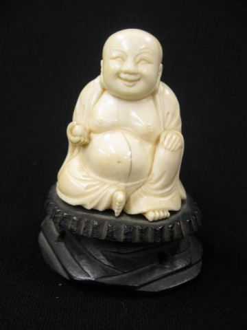 Carved Ivory Figurine of a Seated