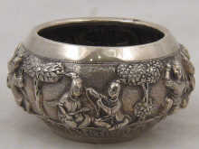 A Burmese silver bowl heavily embossed