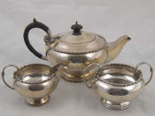 A three piece silver tea set by Walker