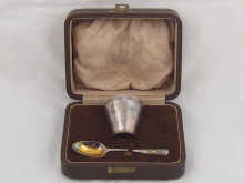 A silver egg cup and spoon by David 14d944