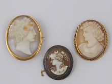 Three cameo brooches two in yellow