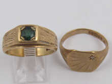 Two 9 ct. gold rings one set with