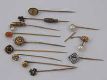 A collection of eleven stick pins