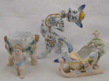 Three ceramic items being a strutting