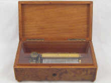 A burr walnut musical box playing six