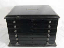 A six drawer ebonised jewellers cabinet