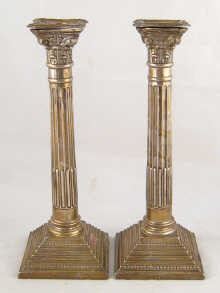 A pair of Corinthian column silver candle