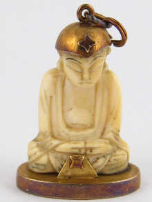 A hand carved ivory Buddha mounted 14da84
