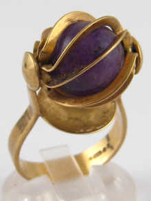 A 9 carat gold ring set with amethyst