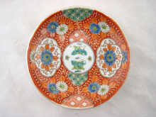 A Chinese plate decorated in the famille
