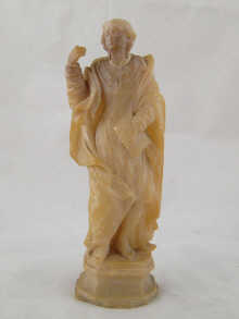 An alabaster figure of a figure