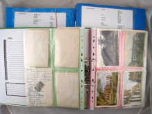 Three large binders of postcards in