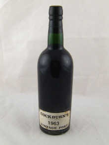 A bottle of Cockburns Vintage Port 1963.