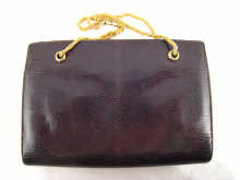 A lizard skin ladys handbag with gilt