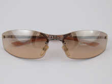 A pair of Dior sunglasses in protective