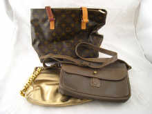 A Louis Vuitton handbag 32cm. across