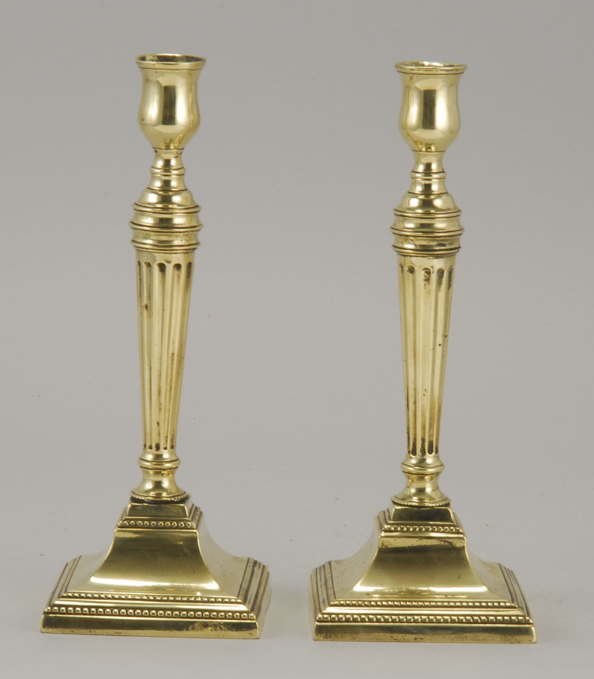 PAIR OF ANTIQUE BRASS CANDLESTICKSLate