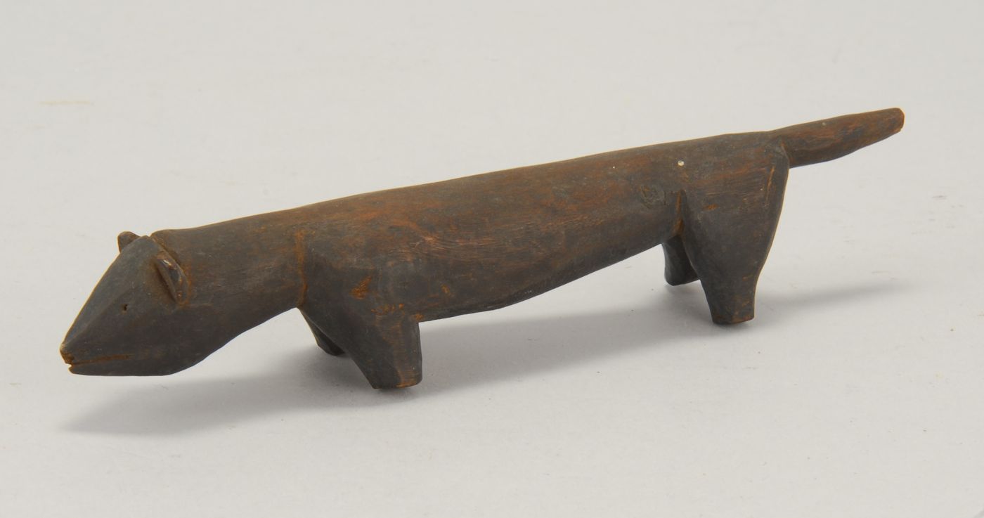 INUIT CARVED WOOD FIGURE OF AN OTTER19th
