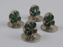 A set of four silver green enamelled