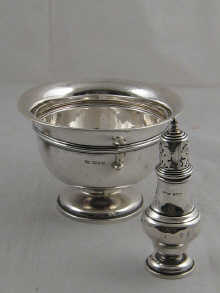 A circular silver rosebowl with everted