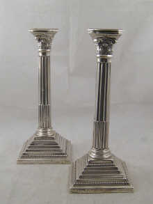 A pair of silver Corinthian column