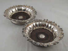 A pair of silver plate ornate wine