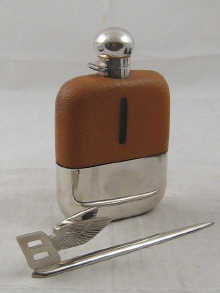 A silver and pigskin covered flask with