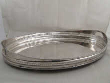 A silver plate large oval galleried