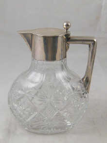 A cut glass claret jug with German 800