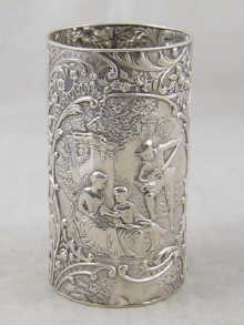 A silver beaker with embossed romantic 14ddd8