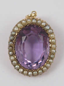 A fine amethyst and pearl pendant set
